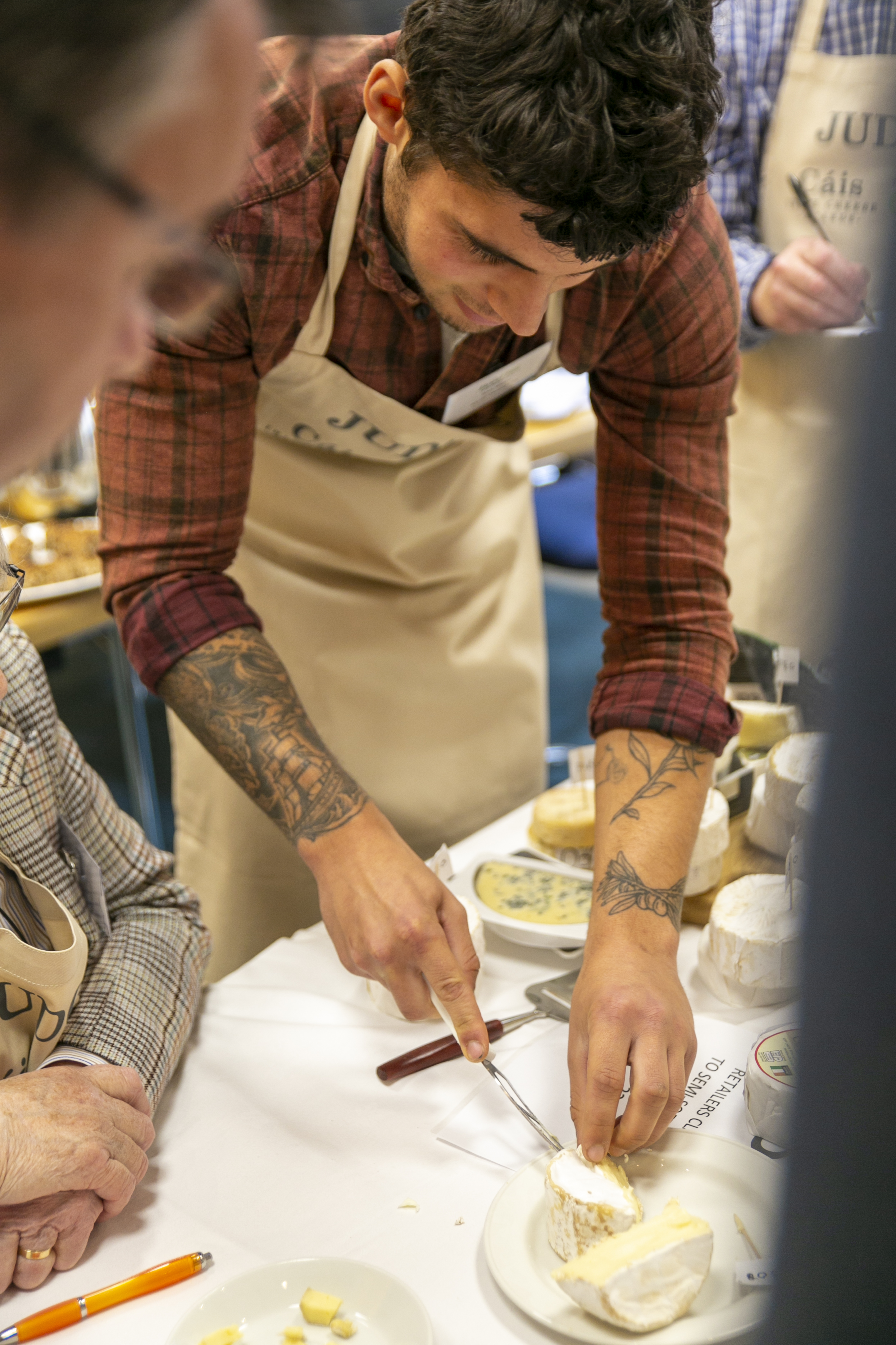 Rory Mellis, Mellis Cheese Ltd cutting cheese and the Irish Cheese Awards